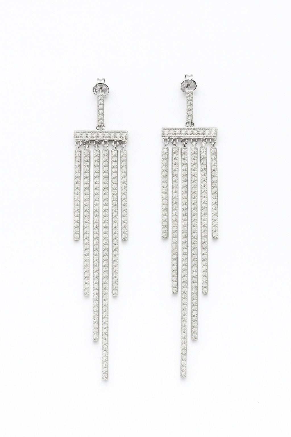 Pair of silver fringe earrings on a white background