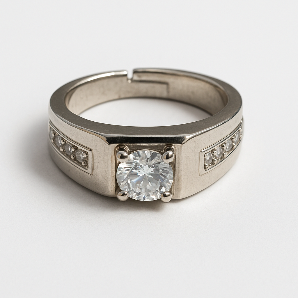 Silver ring with a large diamond and smaller diamonds on the band against a light gray background