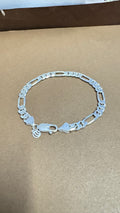 Silver bracelet on a brown background