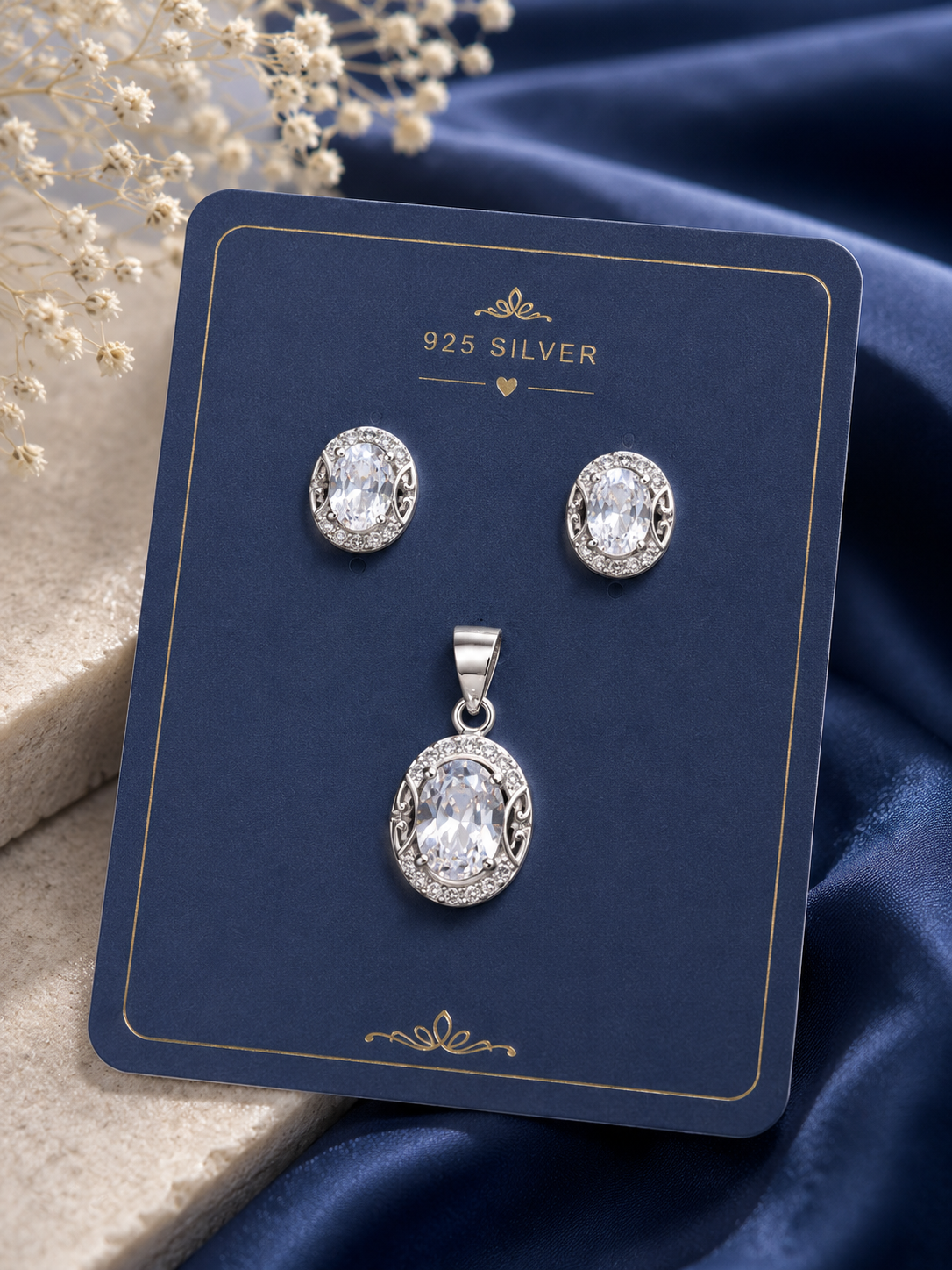 A 925 silver pendant and matching stud earrings 
