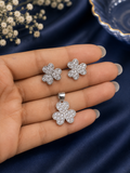 A silver-toned four-leaf clover jewelry set, including a pendant 