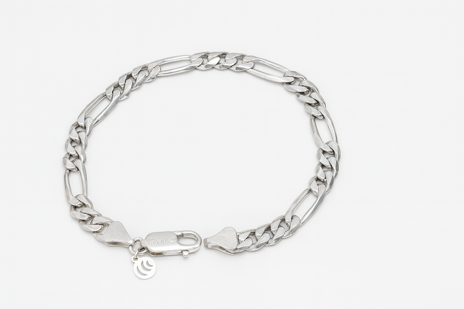 Silver chain bracelet on a white background