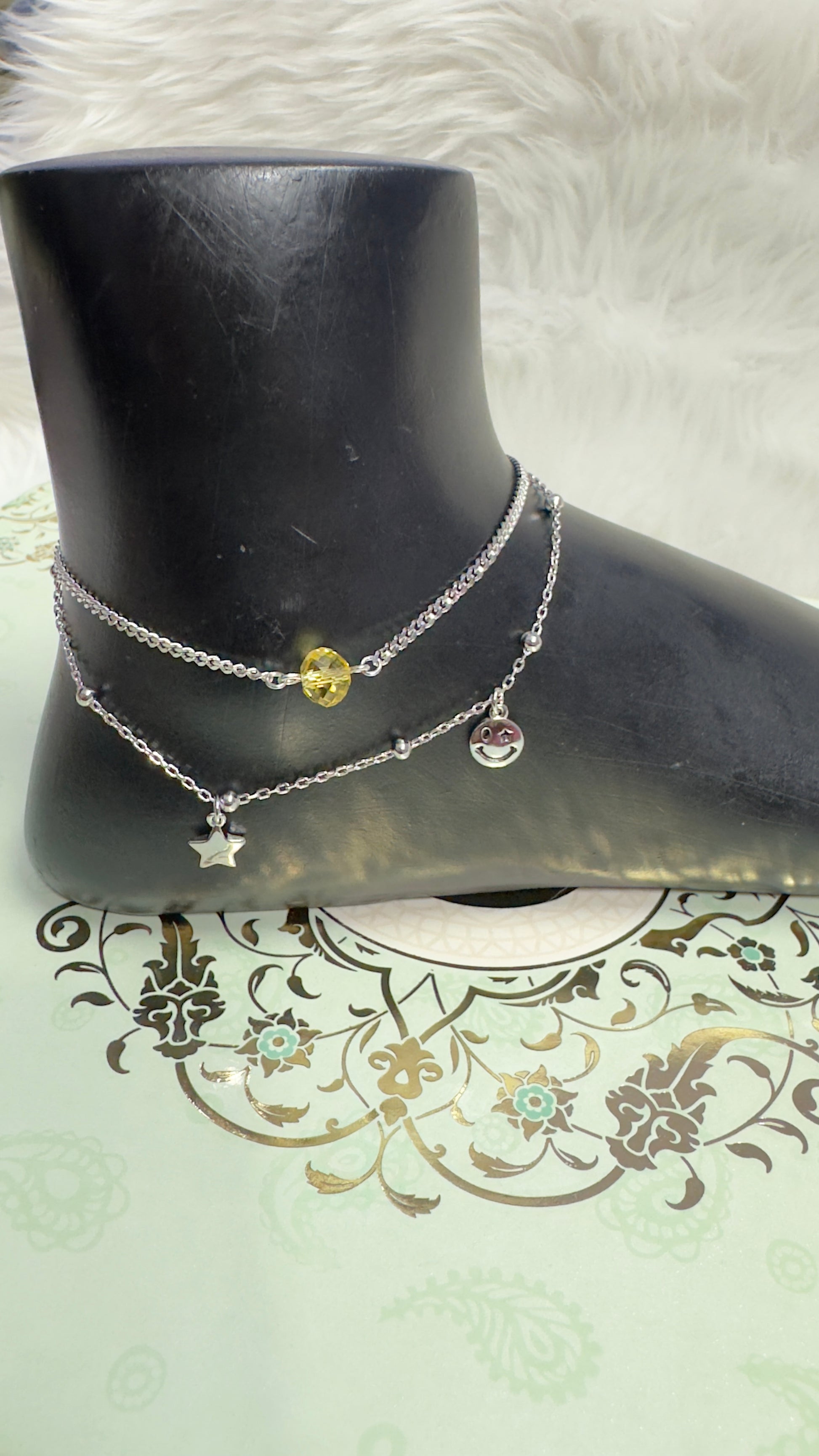 Trendy silver charm anklet with yellow beads and tulip decoration in background









Ask ChatGPT
