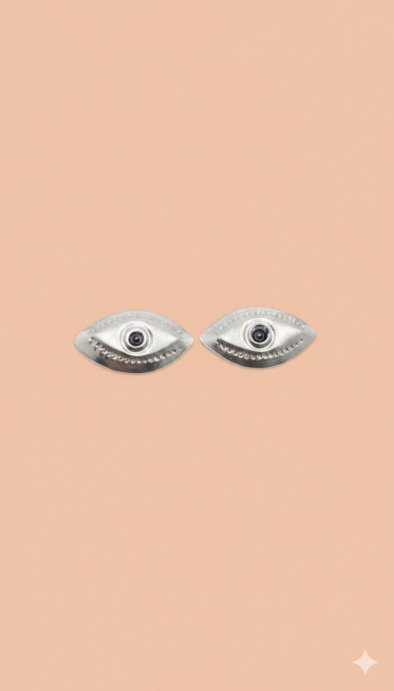 Handcrafted silver eyes symbolic of divine sight and spiritual protection