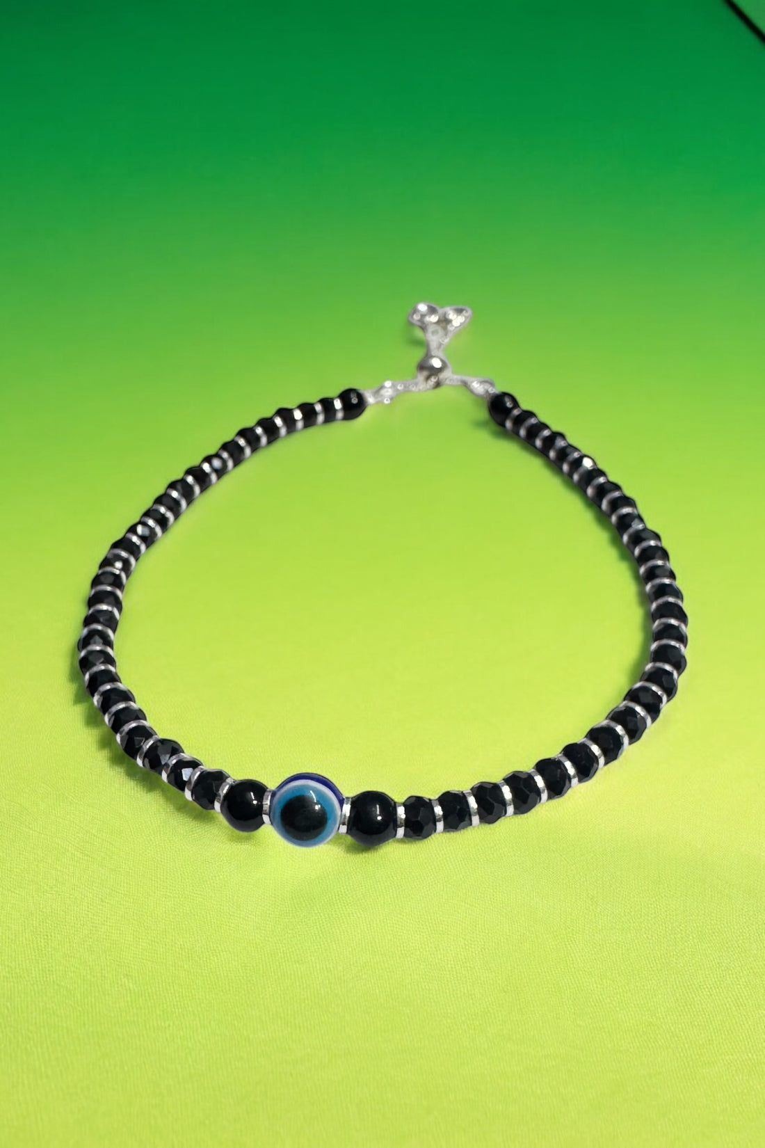 Evil Eye slider Nazariya with black beads in 92.5 HM Silver