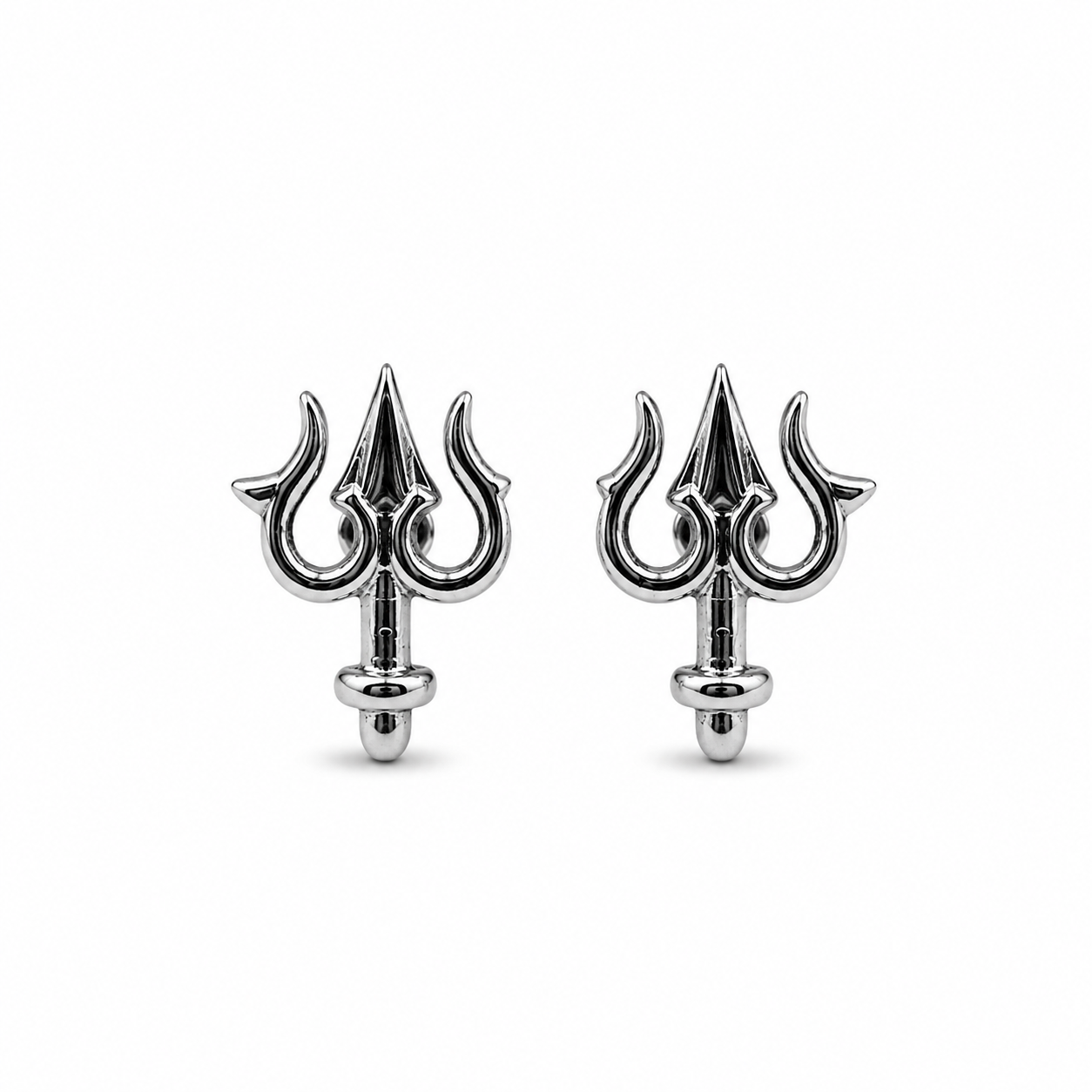 Pair of silver trident earrings on a white background