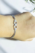 Stylish silver wrist accessory with layered chain design