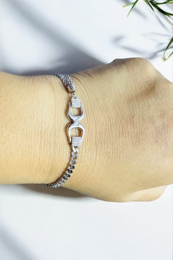 Stylish silver wrist accessory with layered chain design