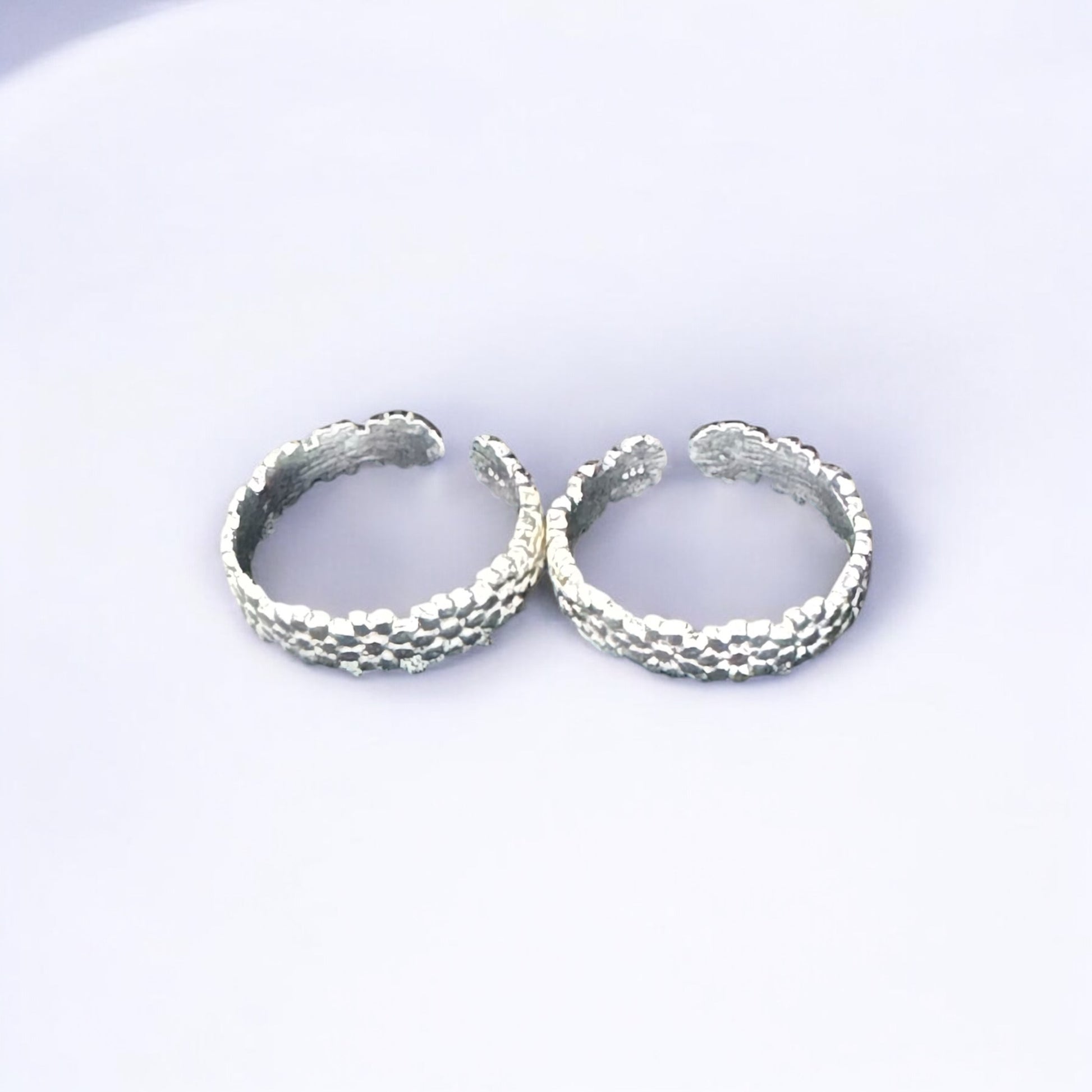 Traditional floral silver toe rings for weddings