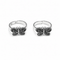 Two butterfly-shaped silver rings on a white background