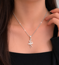 Silver necklace with a ballerina pendant on a model