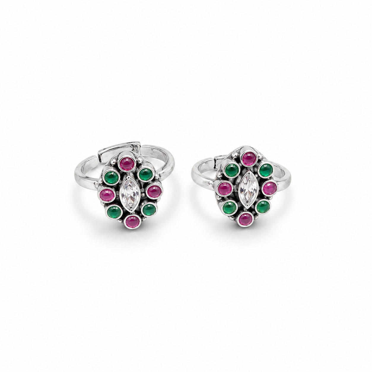 Pair of silver rings with colorful gemstones on a white background