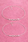 Minimal infinity anklet pair in 925 sterling silver with zircon on neutral background