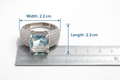 Silver ring with a large gemstone on a white background with measurements shown.