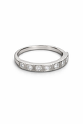 Silver ring with embedded diamonds on a white background