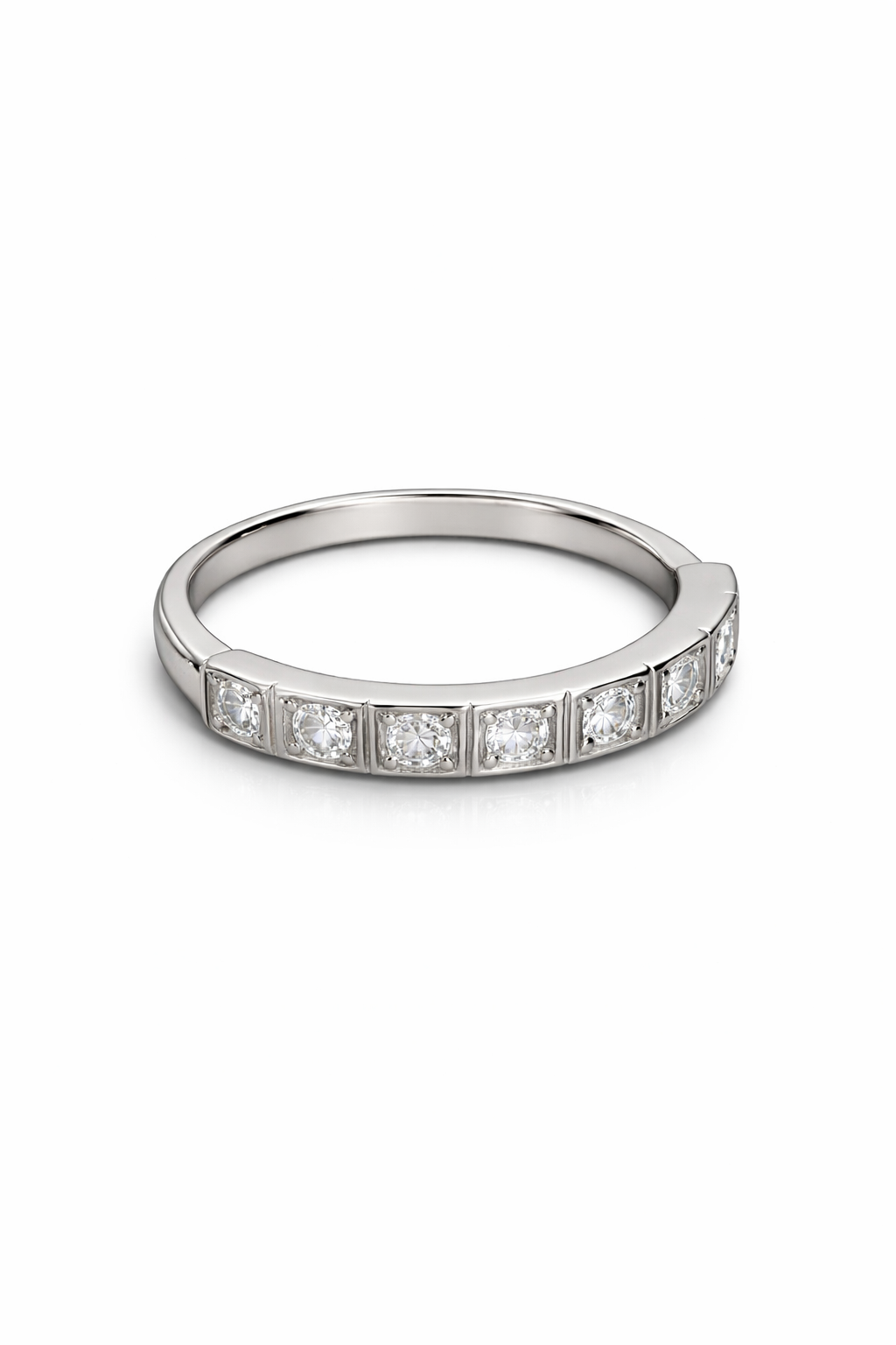 Silver ring with embedded diamonds on a white background
