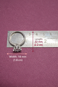 Silver ring with measurements on a purple background