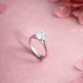 92.5 sterling silver solitaire ring with round cut diamond on white background