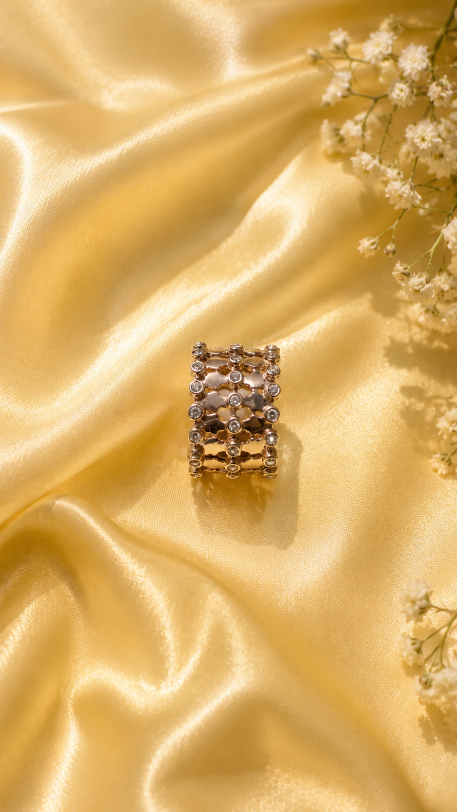 Elegant rose gold bracelet jewellery product shot with blue silk aesthetic backdrop