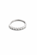Silver ring with small diamonds on a white background