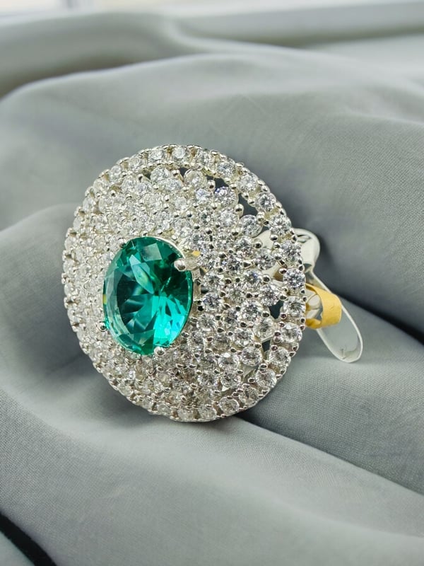 A traditional sophisticated 925 silver ring with white and green stones which soothing your eyes