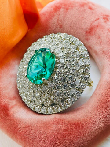 A traditional sophisticated 925 silver ring with white and green stones which soothing your eyes