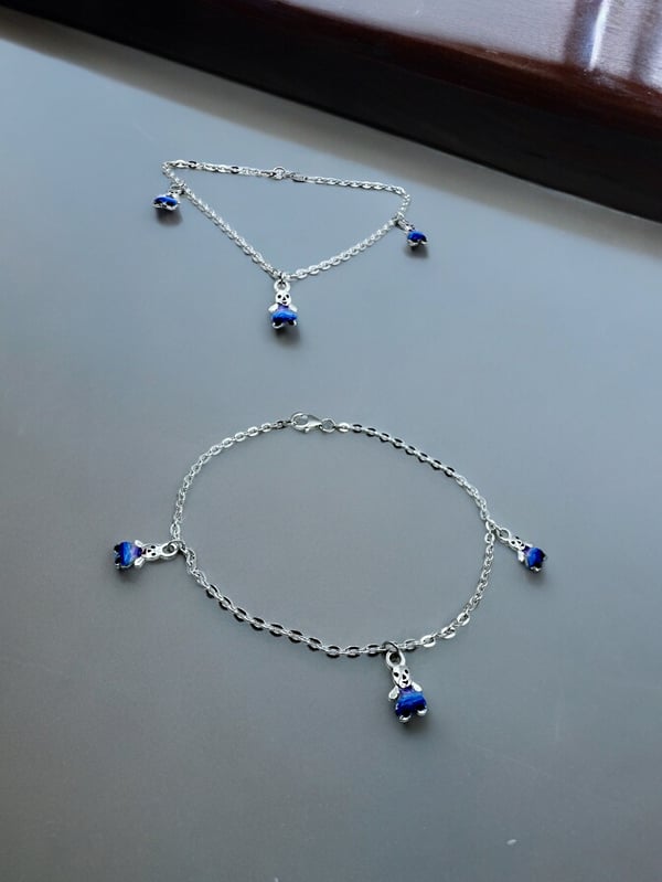 Cute 925 silver anklet with blue teddy bear design.