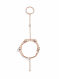 Rose gold bracelet with diamond accents on a white background